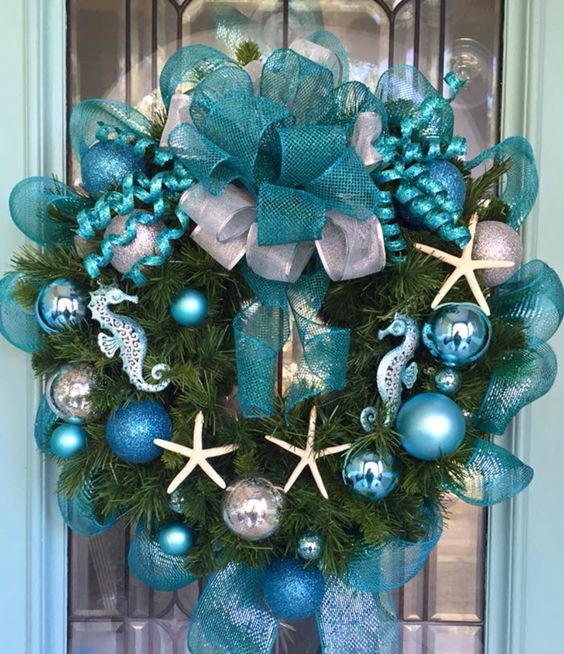 Blue christmas wreath hanging on a door